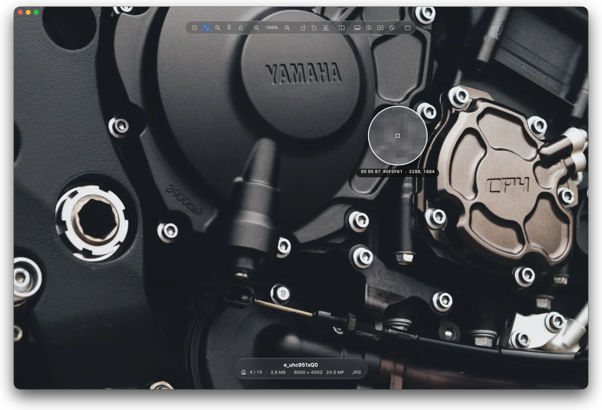 A motorcycle engine at 100 % in Pictty, with the pixel loupe showing the exact pixels, their RGB values and the hex colour.